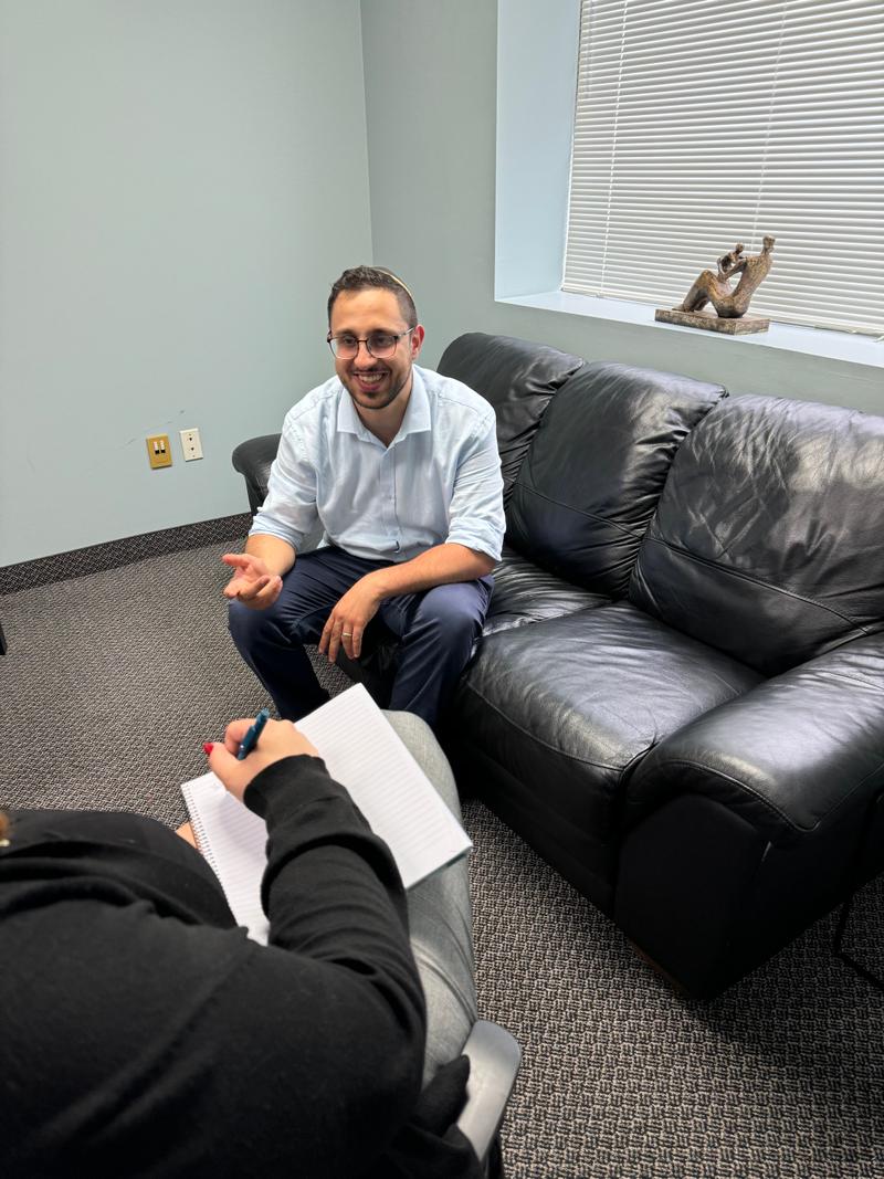 A therapist smiling during a session at the Trust Therapy clinic in Thornhill