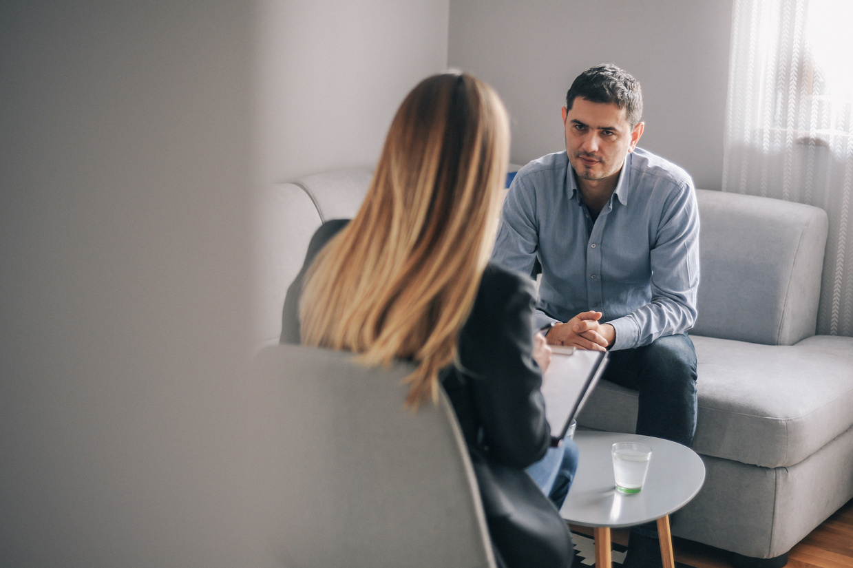 Mid age man having on on one counselling meeting